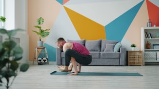 Man practicing yoga crow pose on mat
