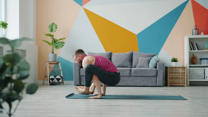 Instructor Rohan Deshmukh in a focused Power Yoga pose