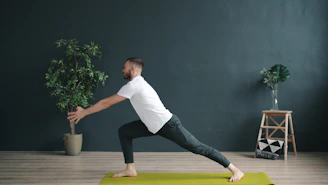 Man doing a yoga pose on a mat.