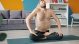 Man doing yoga in a living room