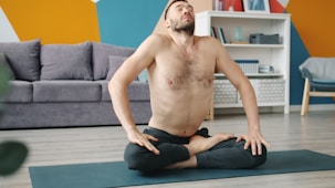 Man doing yoga in a living room