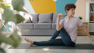 Woman doing a seated spinal twist yoga pose