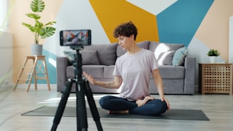 Woman recording yoga tutorial on smartphone tripod