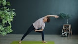 Woman practicing yoga in a room