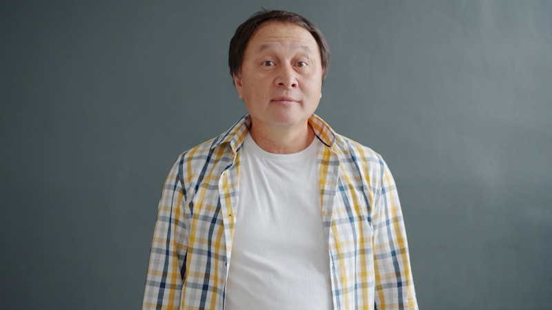 Casual wealthy man in plaid and white shirt