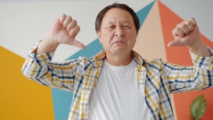 Man giving two thumbs down gesture