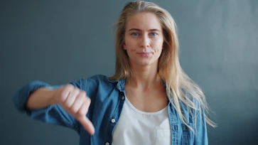 Woman giving a thumbs down gesture