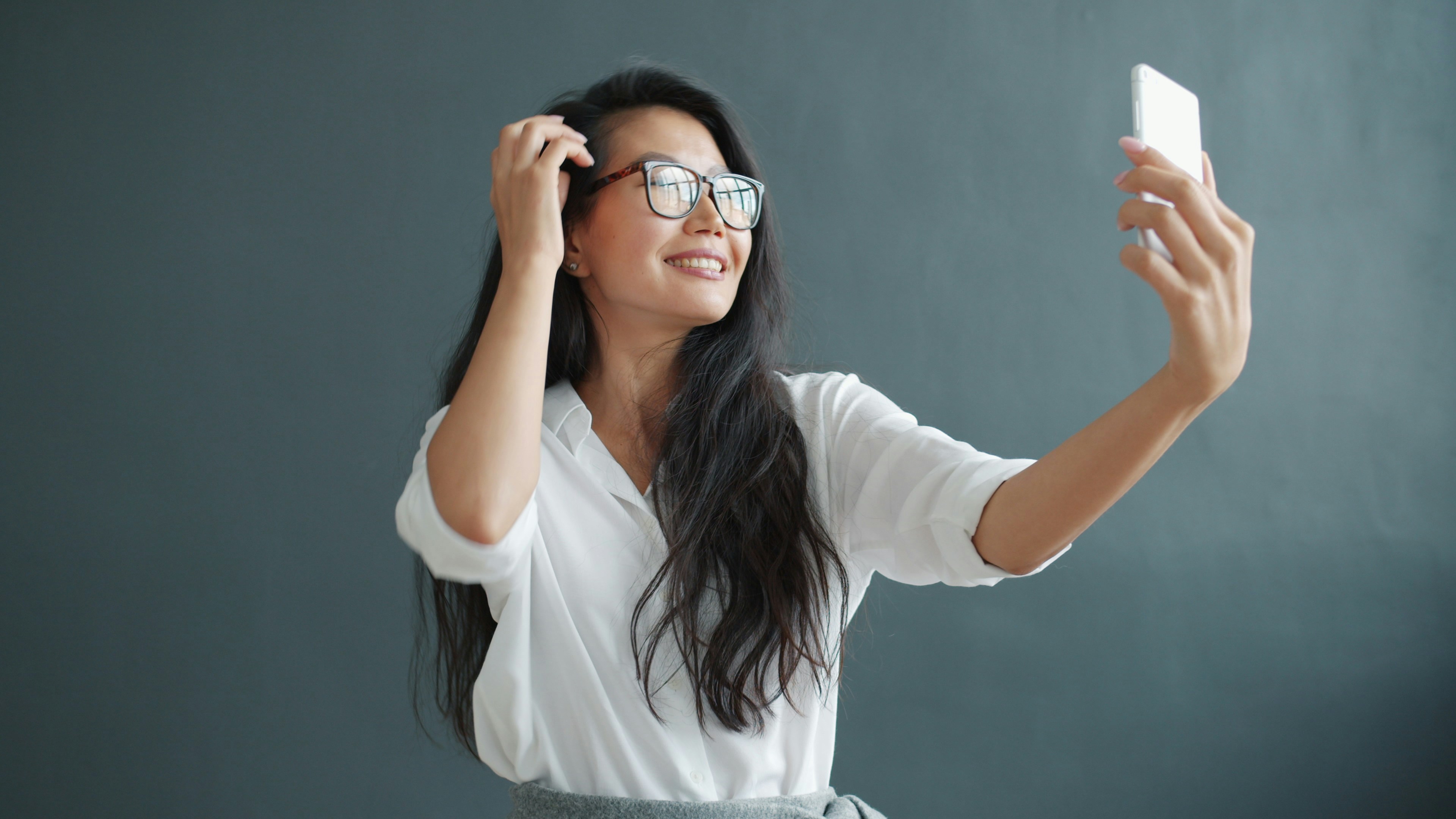 Female Instagram influencer smiling, using AI persona creation tools