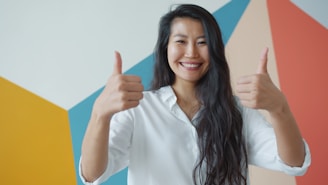 Woman giving two thumbs up with a smile