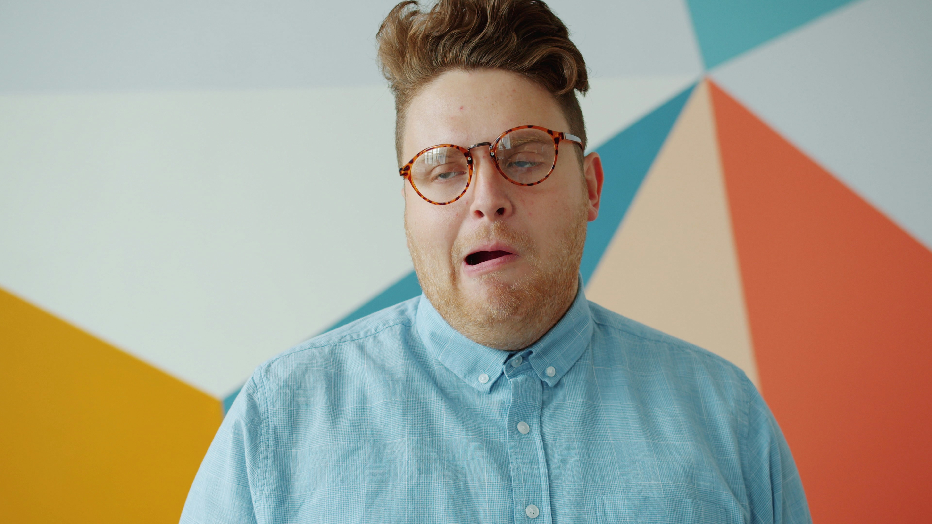 Man with glasses making a funny face