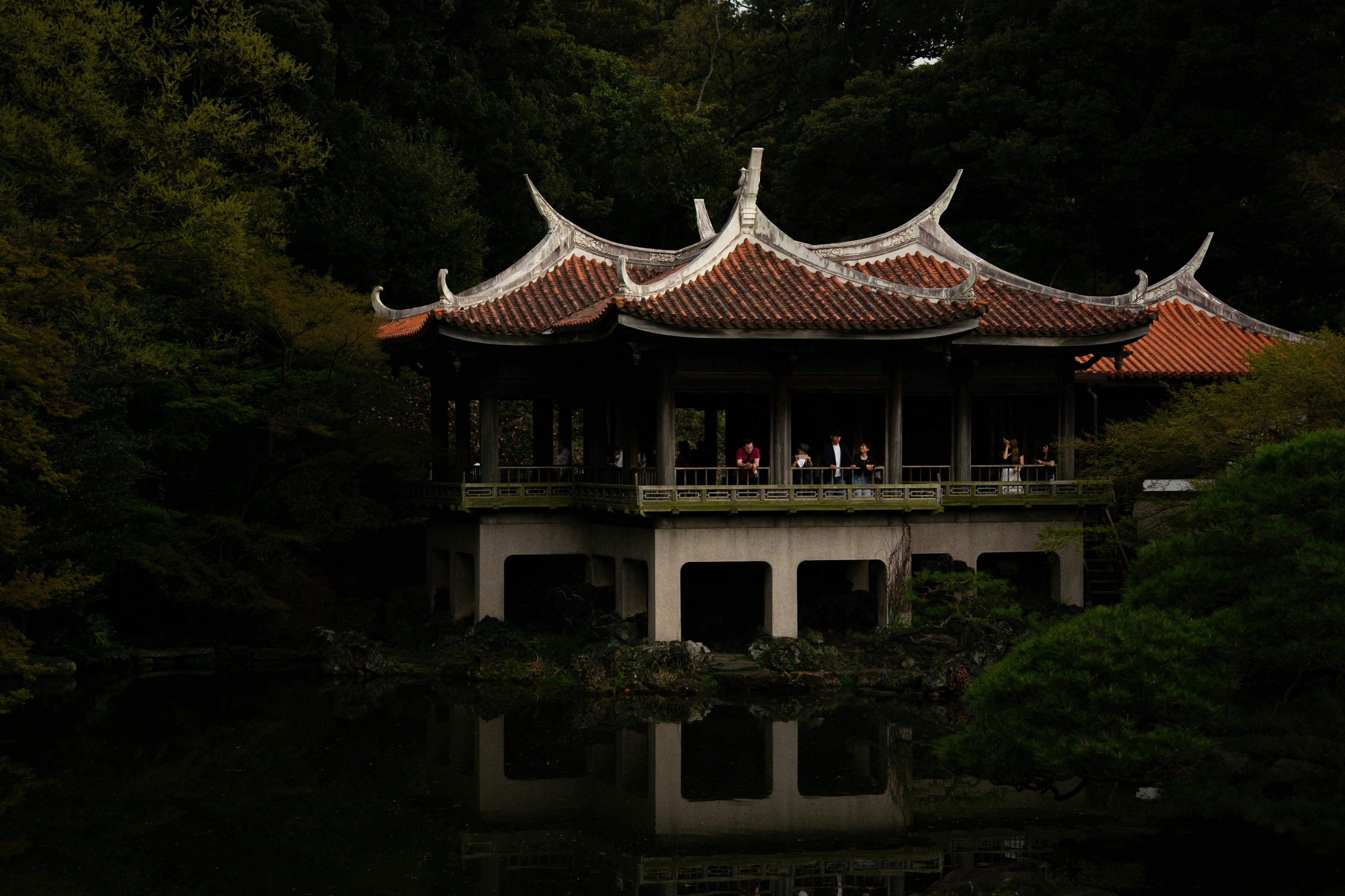 Traditional japanese building reflected in calm water