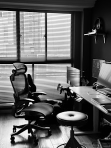 Ergonomic chair and desk setup with computer.