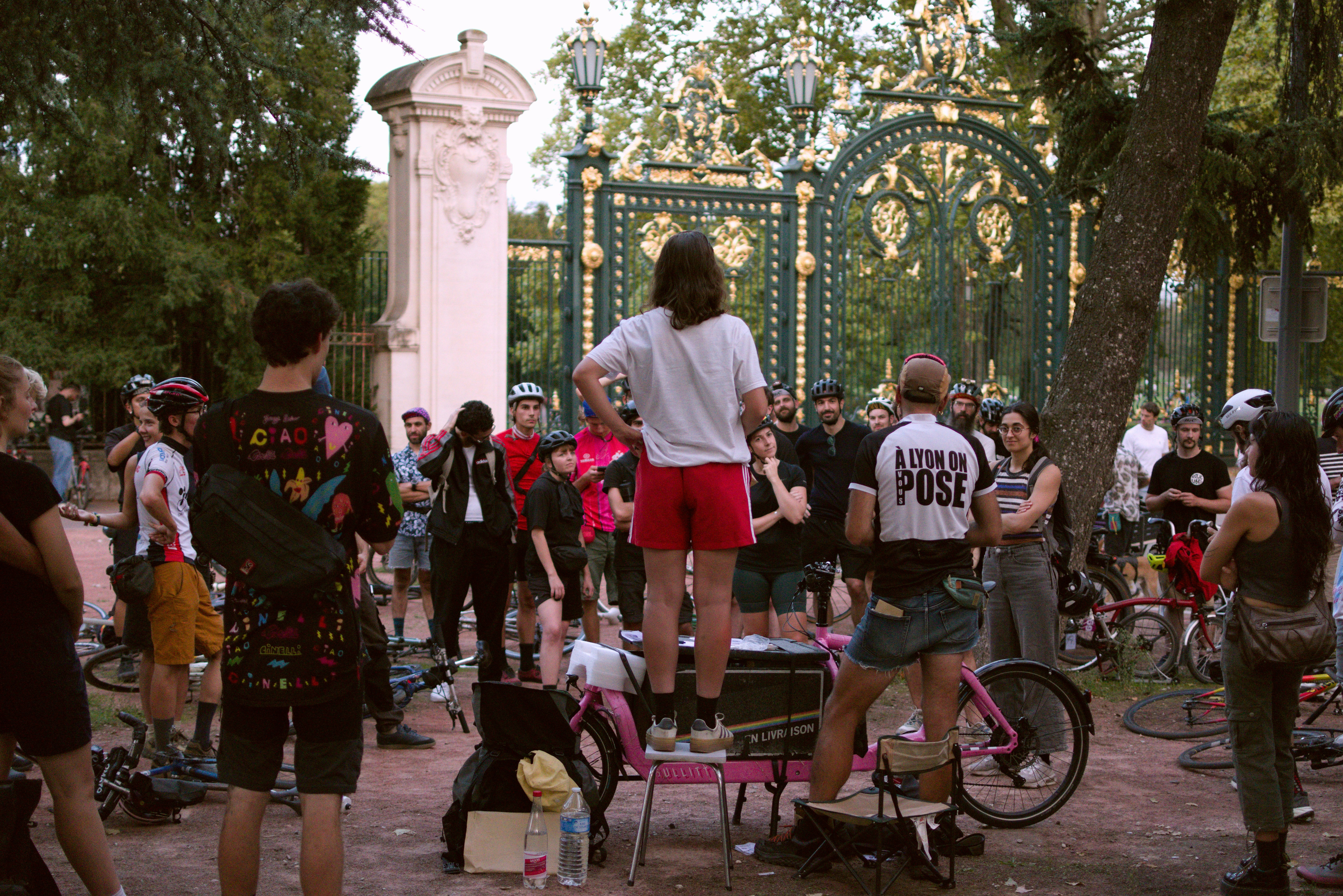 A group of urban cyclists and bicycle messengers gather at the start of an alleycat race