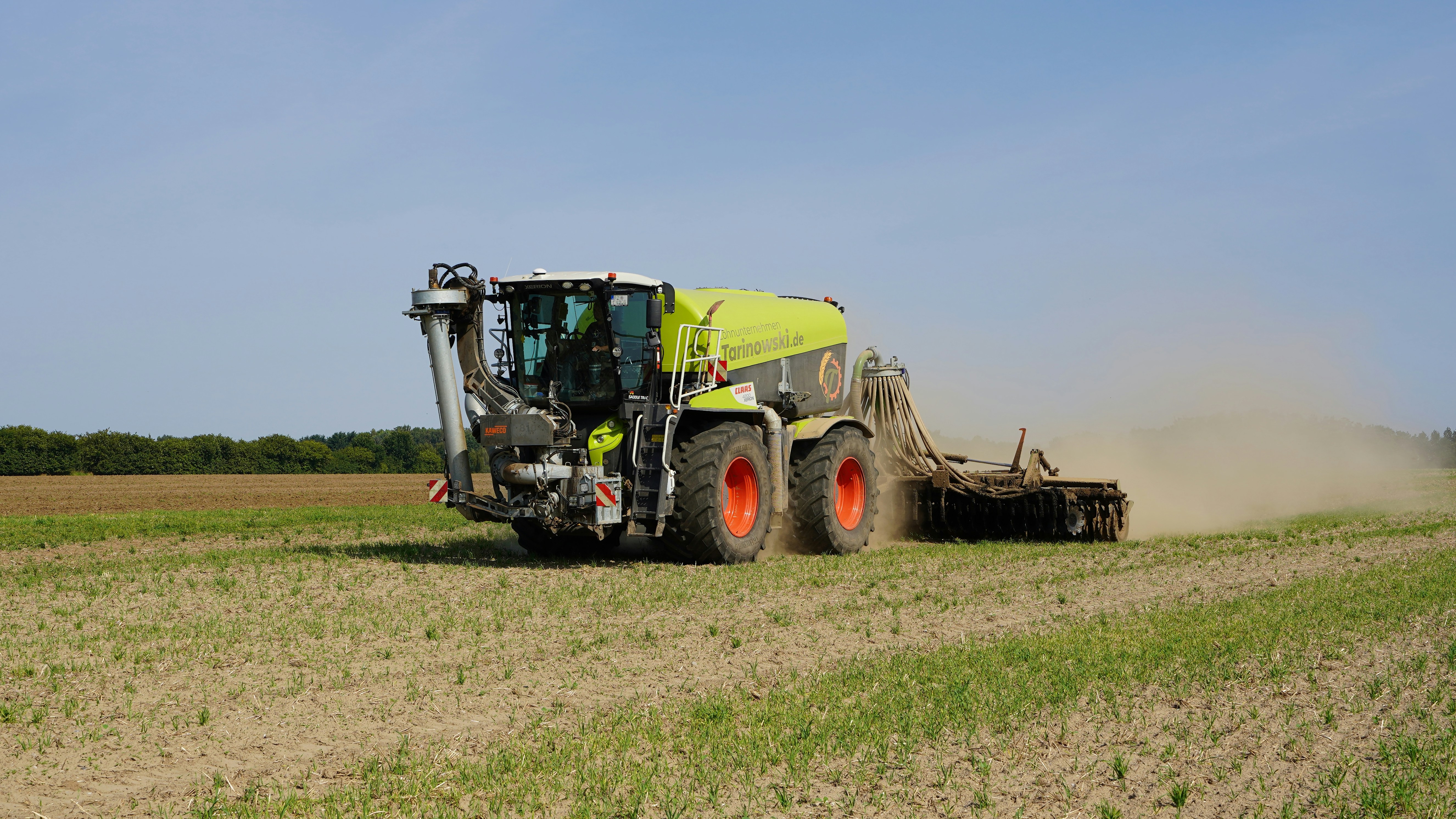 Tractor working in field showing traditional technology