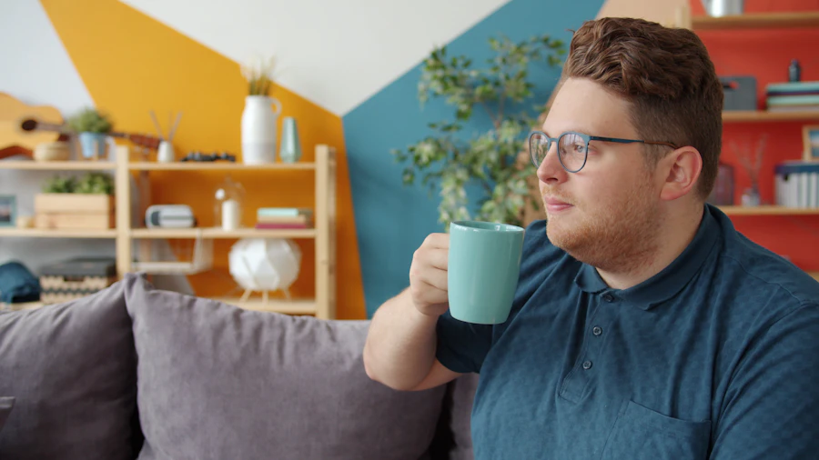 A man relaxing with a cup of coffee at home