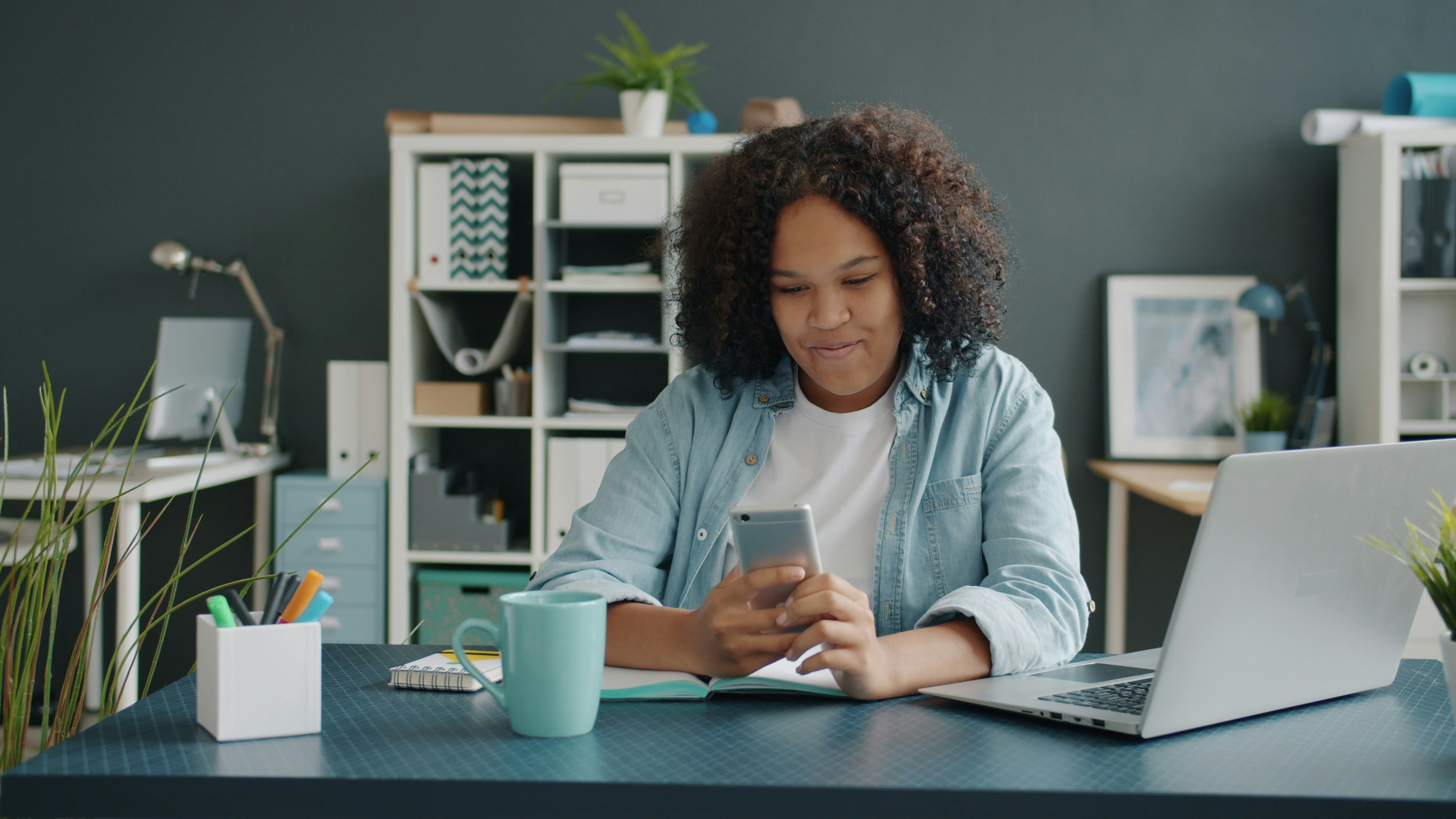 Beautiful Afro-American lady entrepreneur working in office
