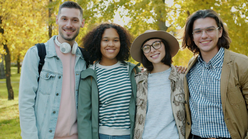 open-minded friends smiling together in autumn