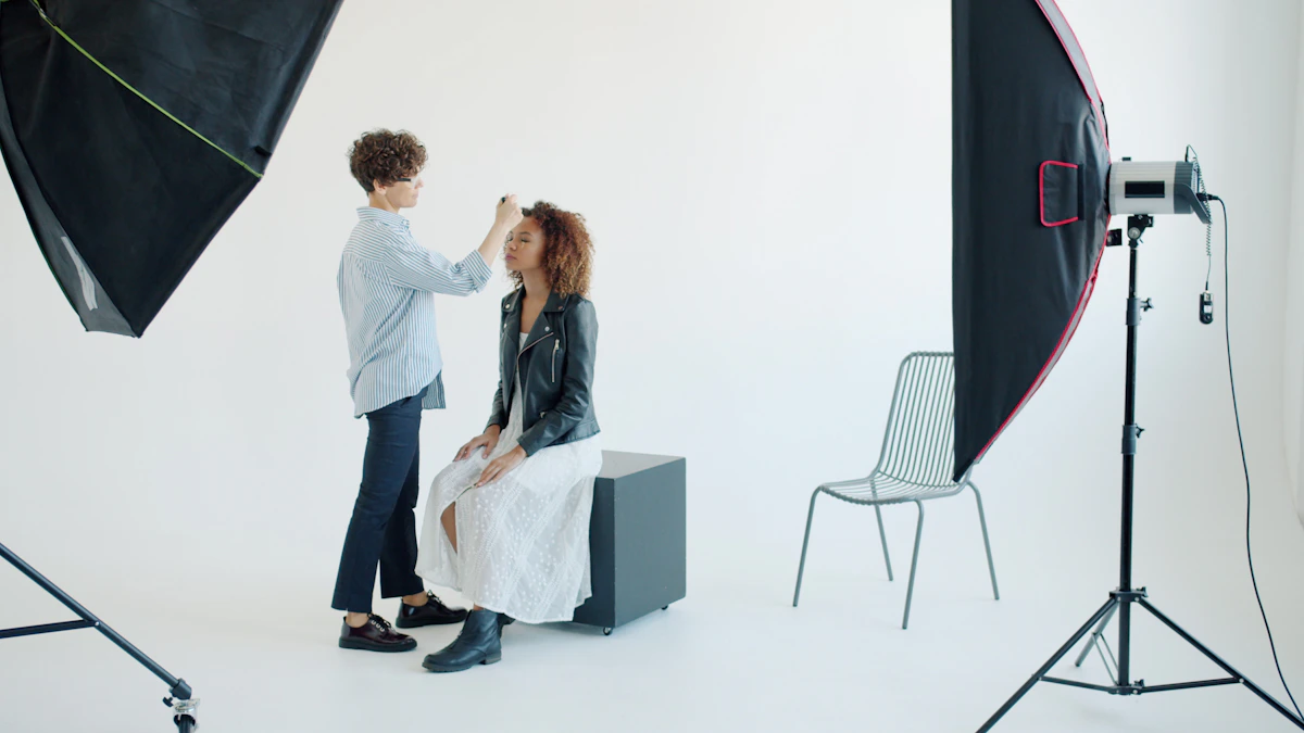 Makeup artist applying makeup to a model in a studio