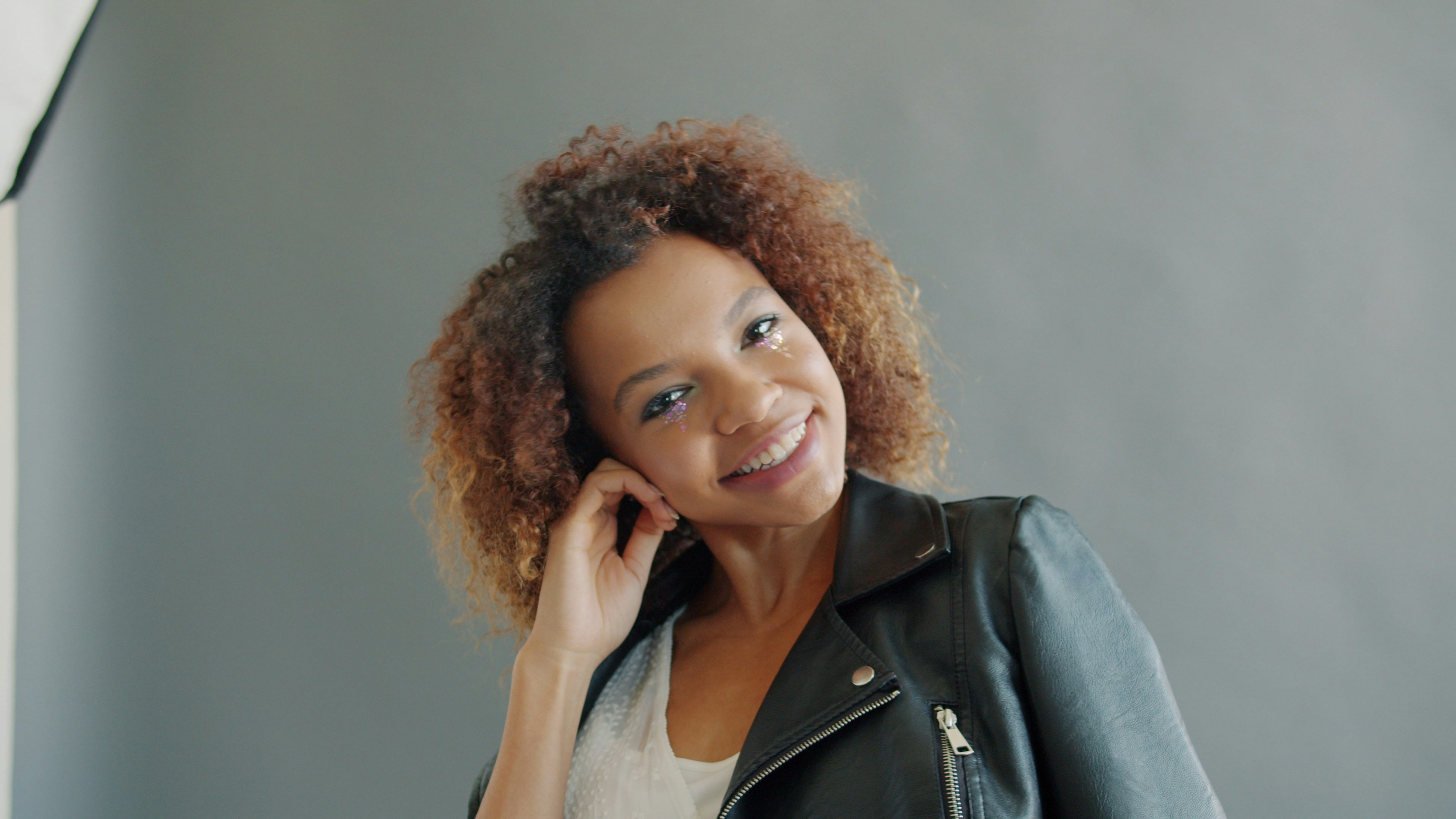 Portrait of pretty young mixed race woman model smiling