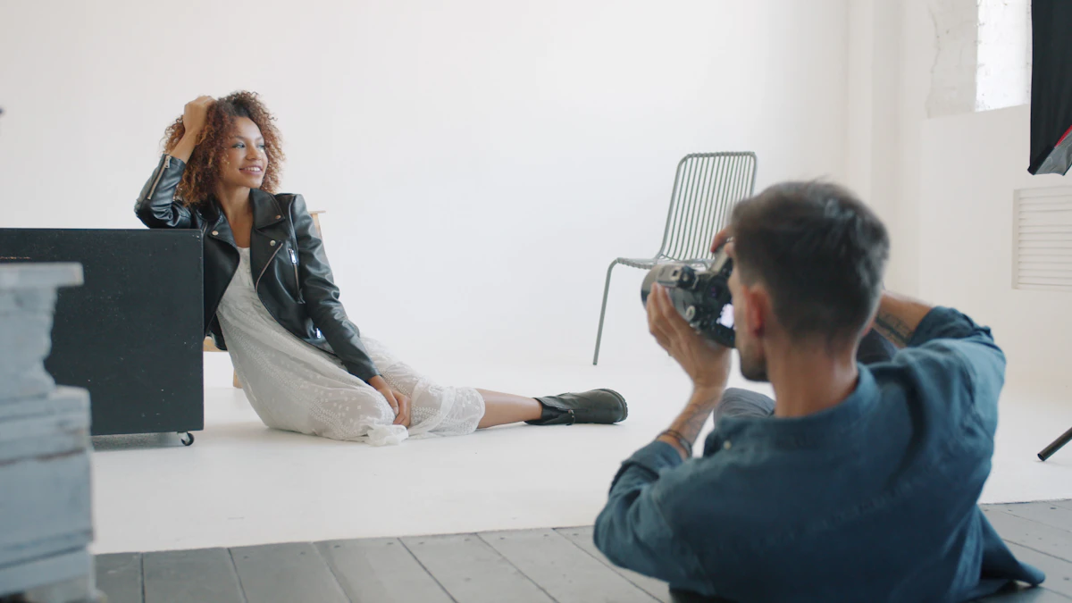 A photographer photographing a woman in a studio