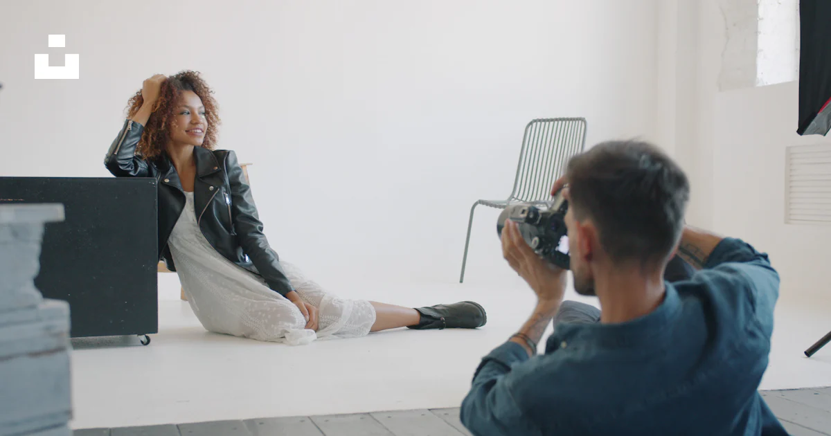 Photographer taking a picture in a professional studio