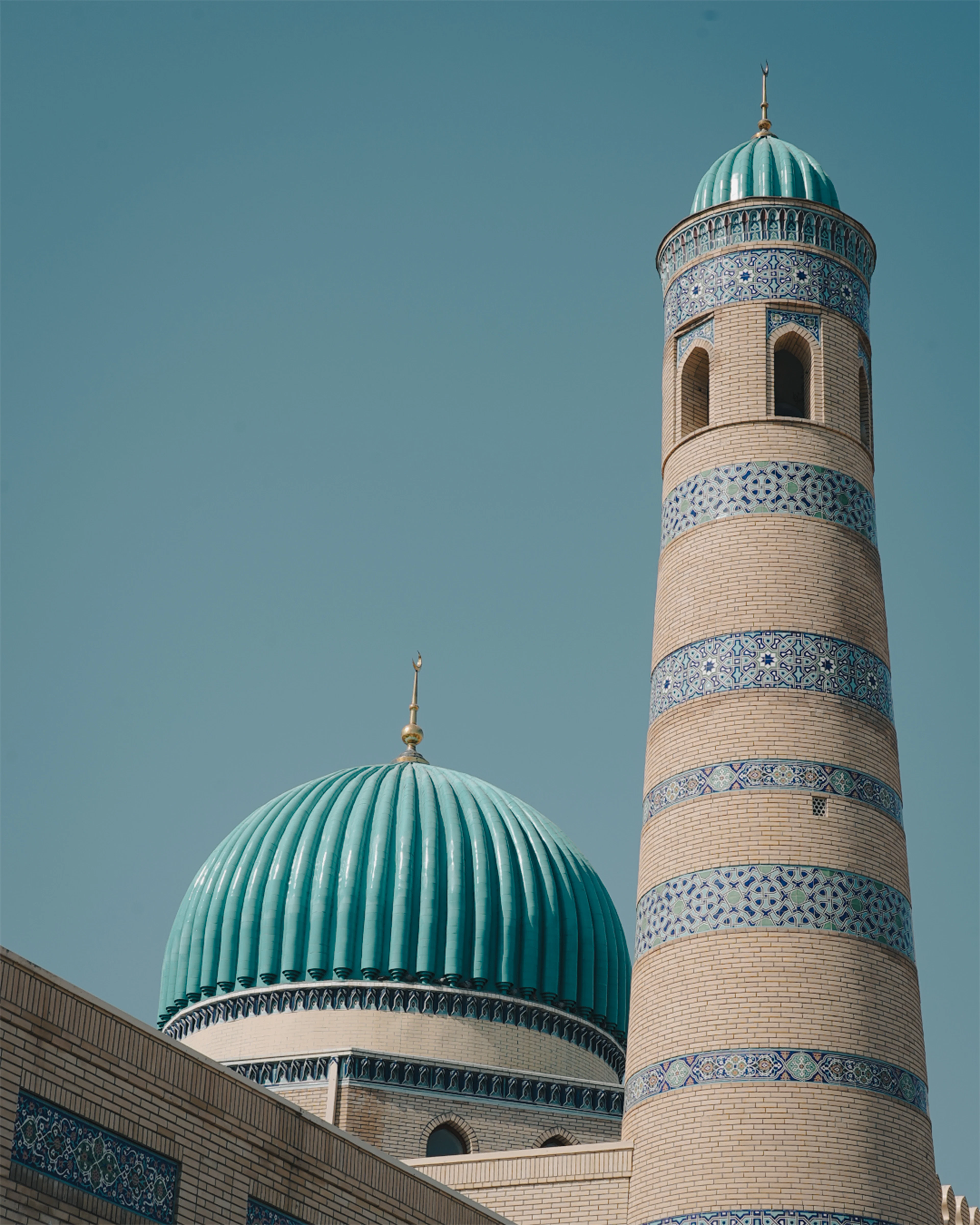 The dome and minaret of Masjid Ibrahim against an open sky