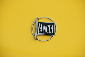 Lancia logo on a yellow background