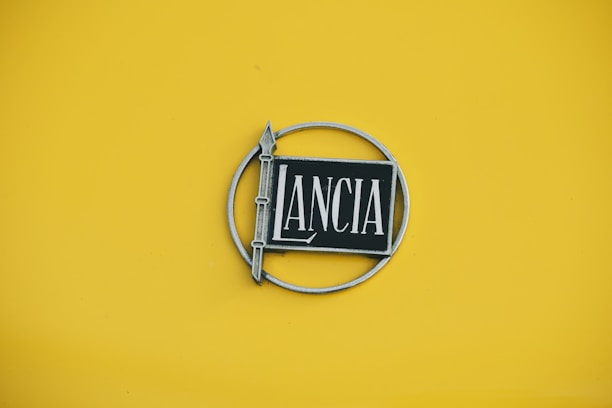Lancia logo on a yellow background