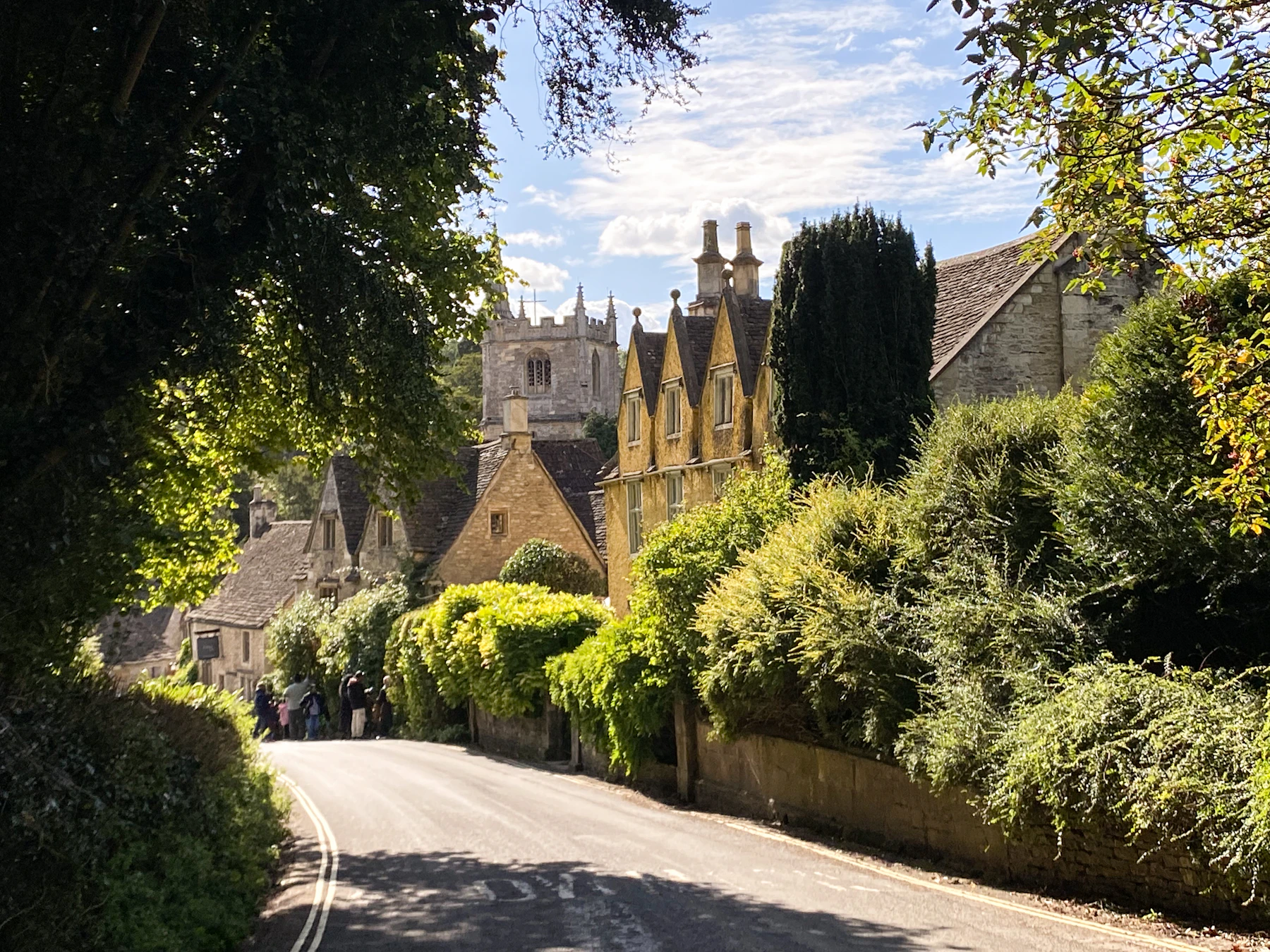 A leafy road through an English village