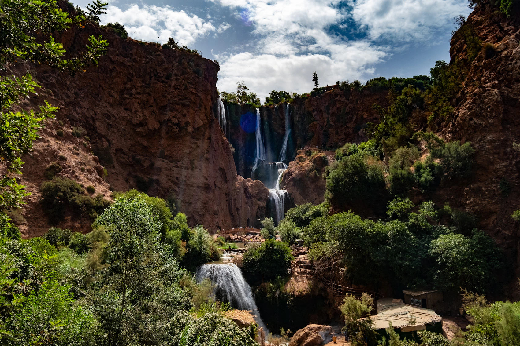 Multiple waterfall streams descending the rocky Ouzoud cliffs