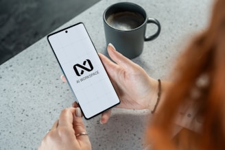 Woman holding smartphone with ai workspace logo.