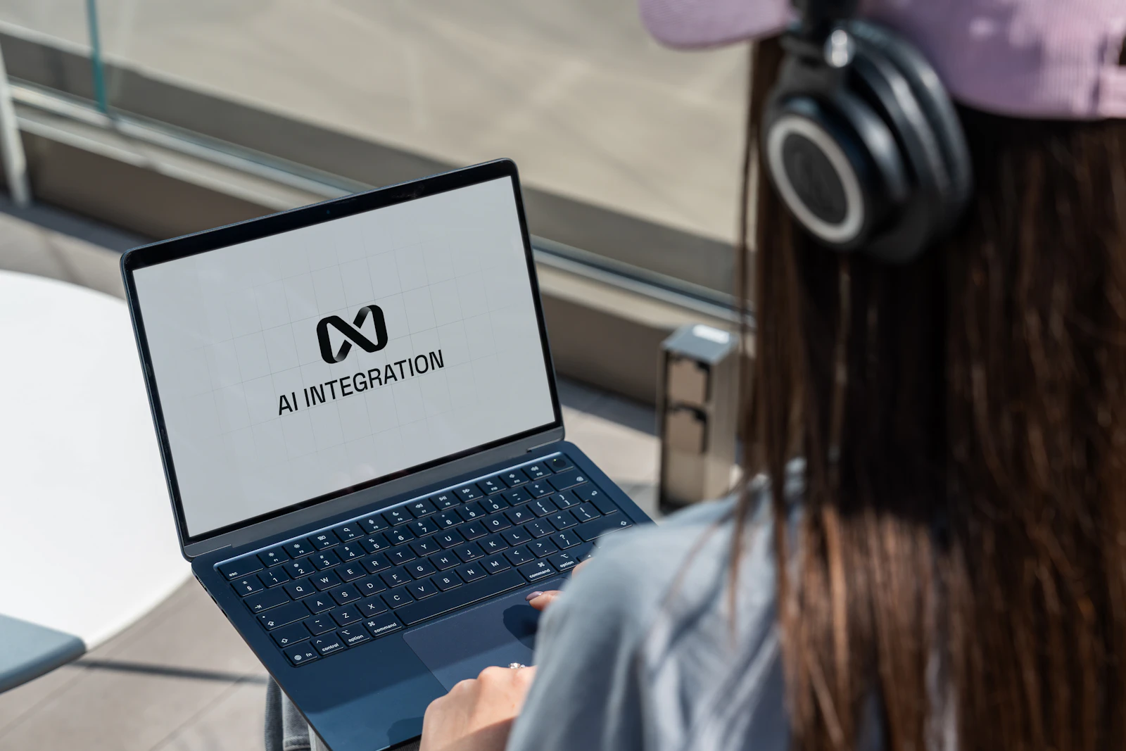 A laptop showing an AI integration interface in a bright workspace