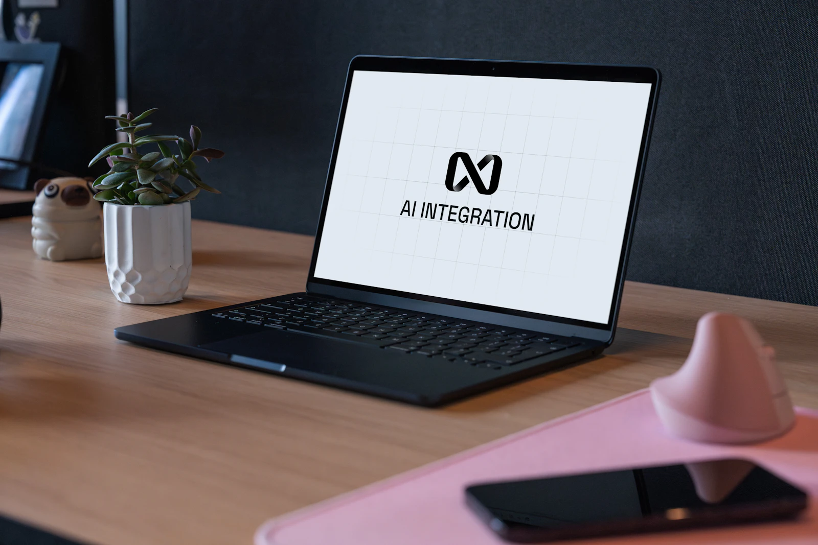 A laptop in an office workspace showing an AI assistant interface