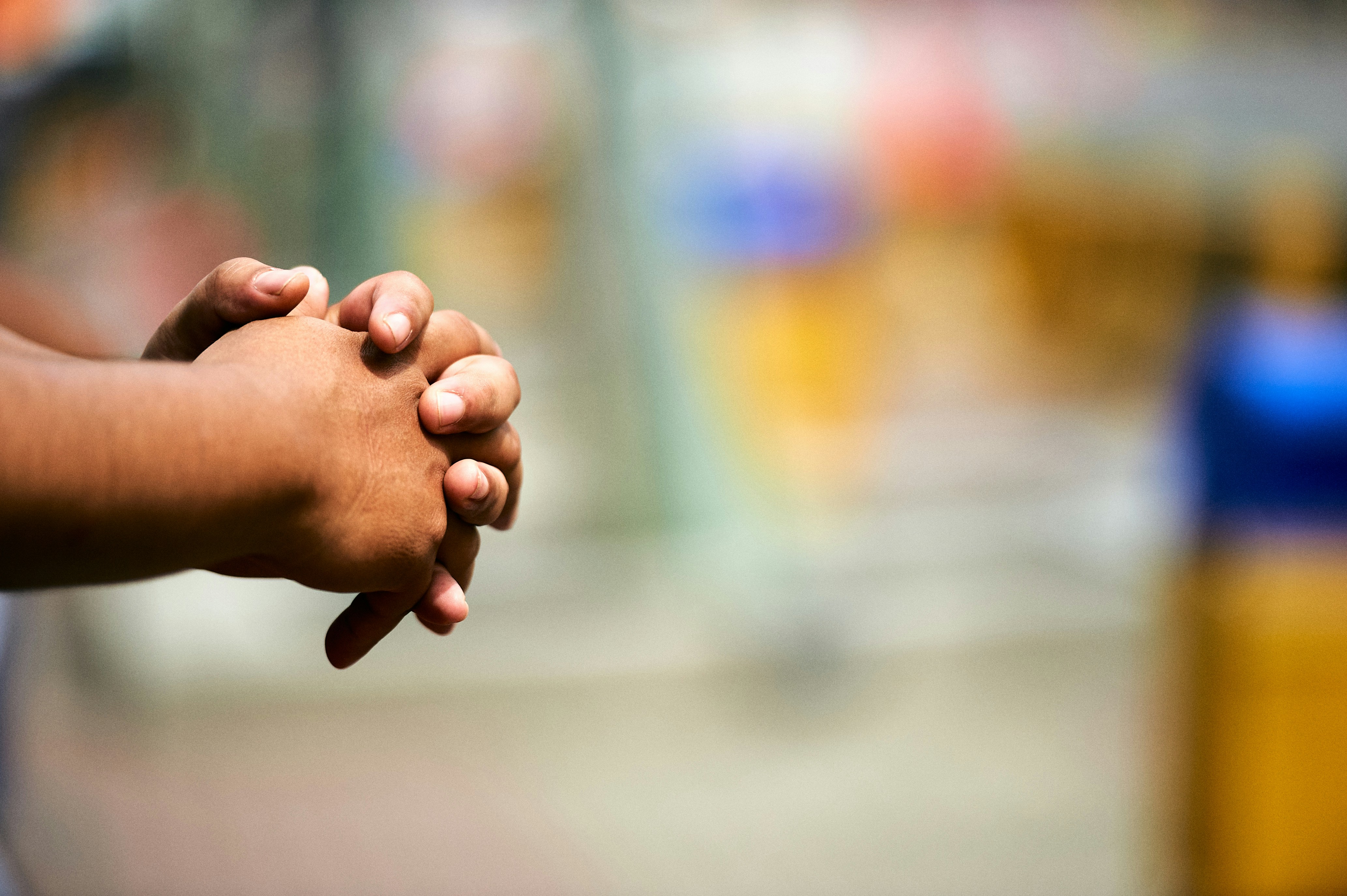 Clasped hands in meditation