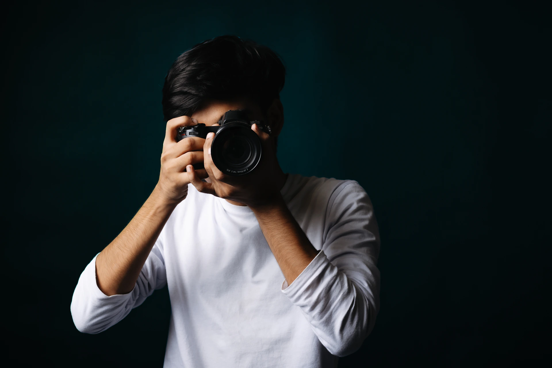 A person holding a camera and taking a picture