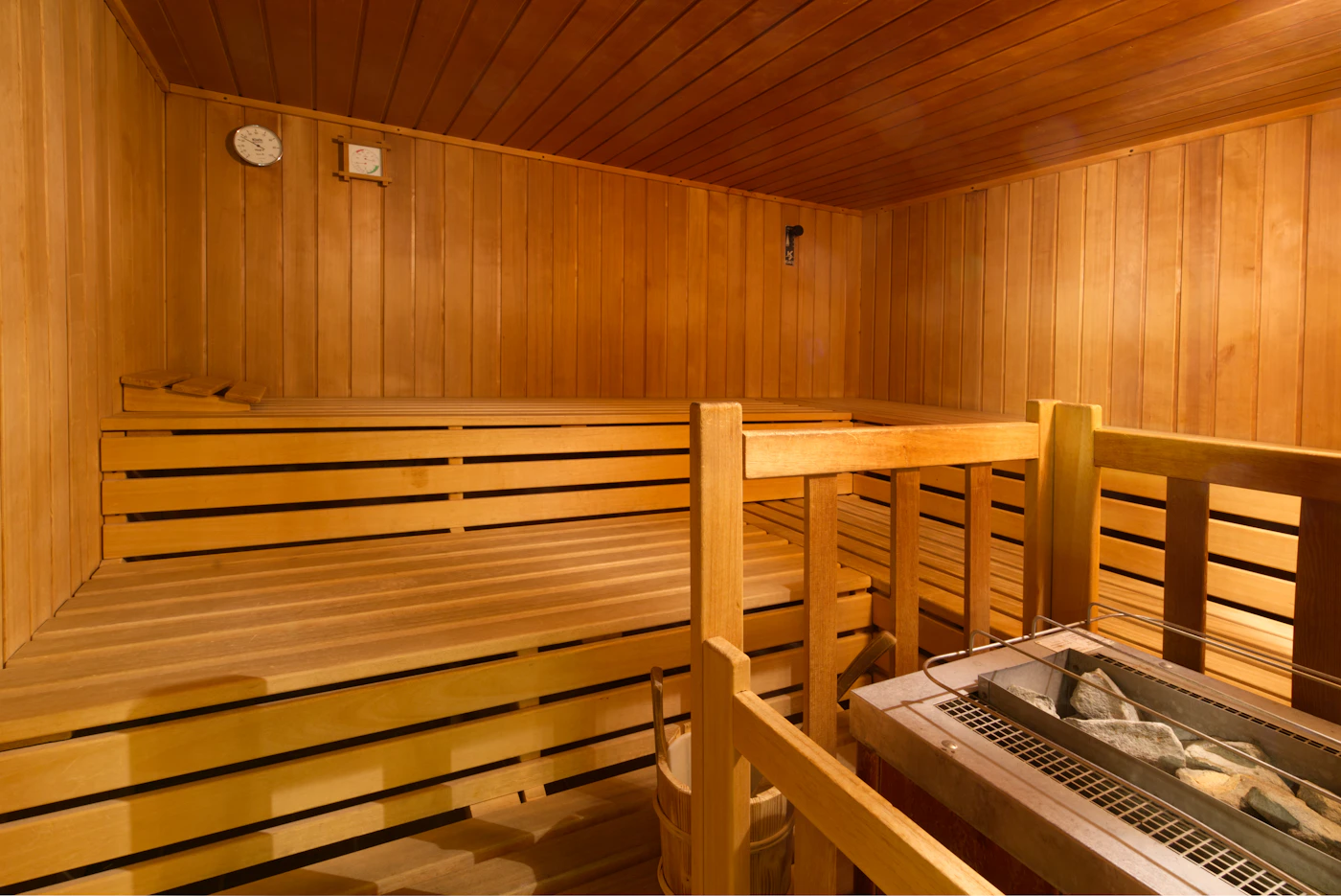 Wooden sauna interior with tiered benches, illustrative photograph