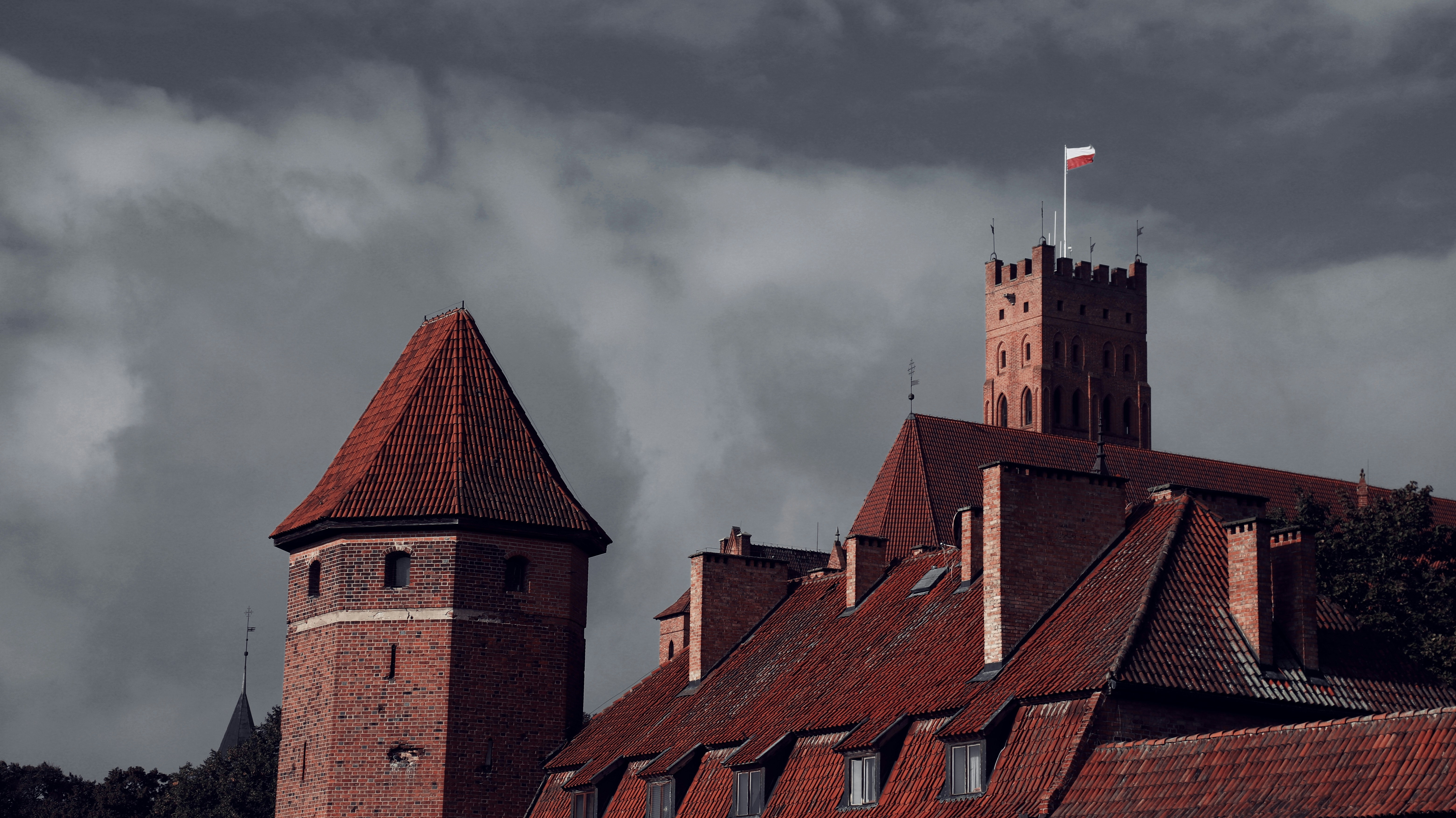 Medieval castle with red tiled roofs and towers