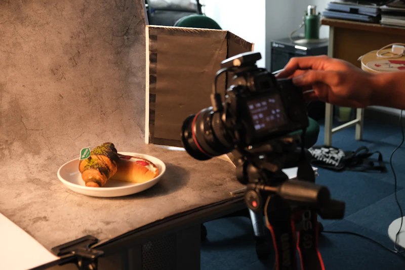 Camera filming a plated dish for restaurant video production