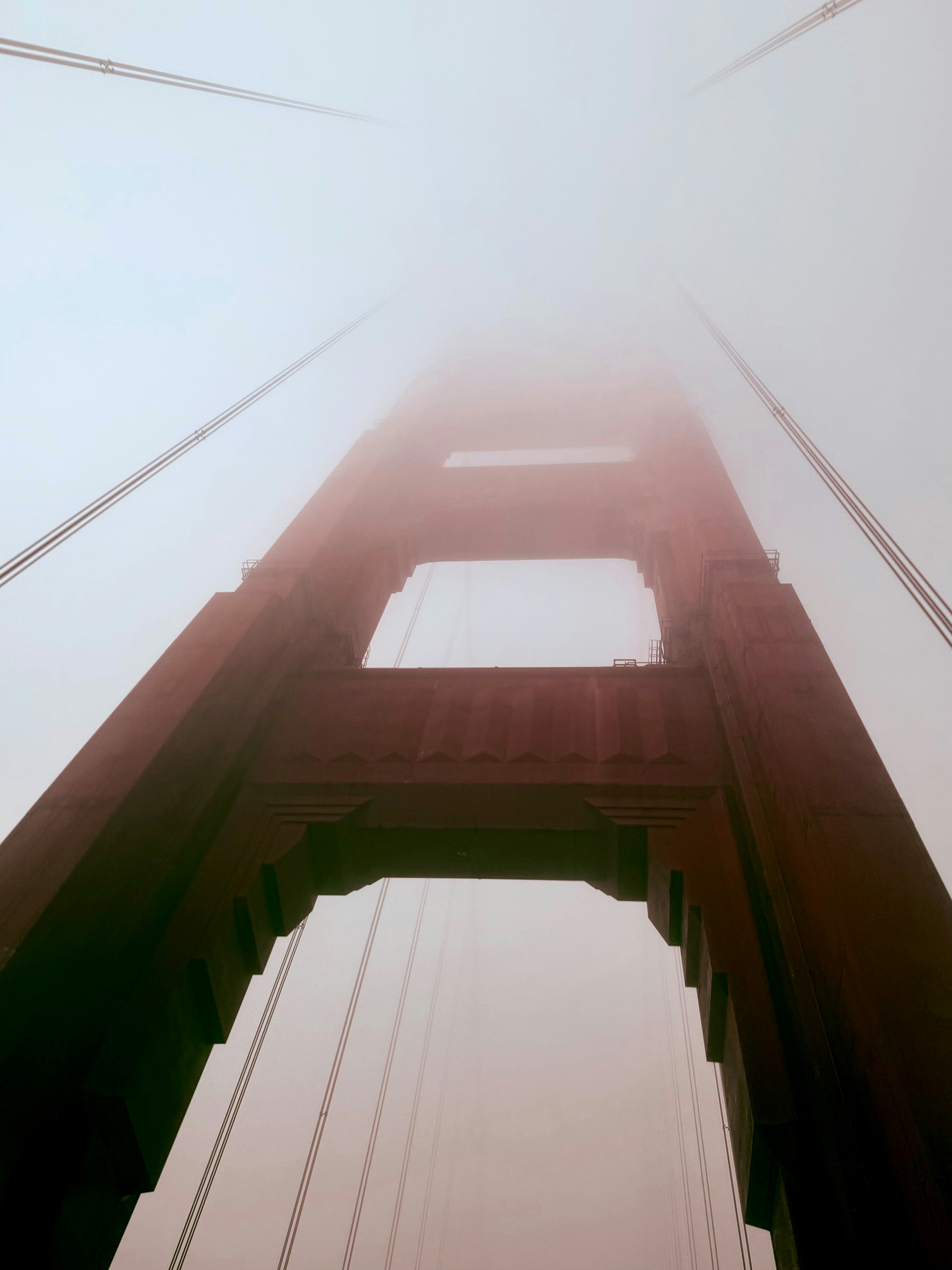 Golden gate bridge tower shrouded in fog