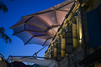 Modern outdoor awning illuminated at dusk