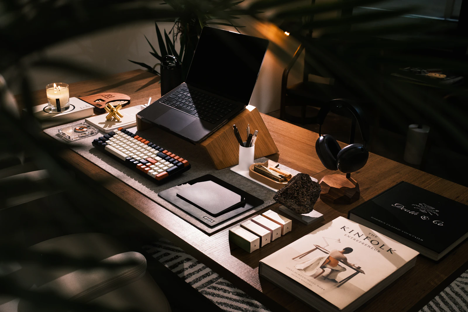 A calm, organized workspace with a laptop and notebook