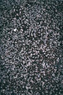 A textured background of small gray gravel stones.
