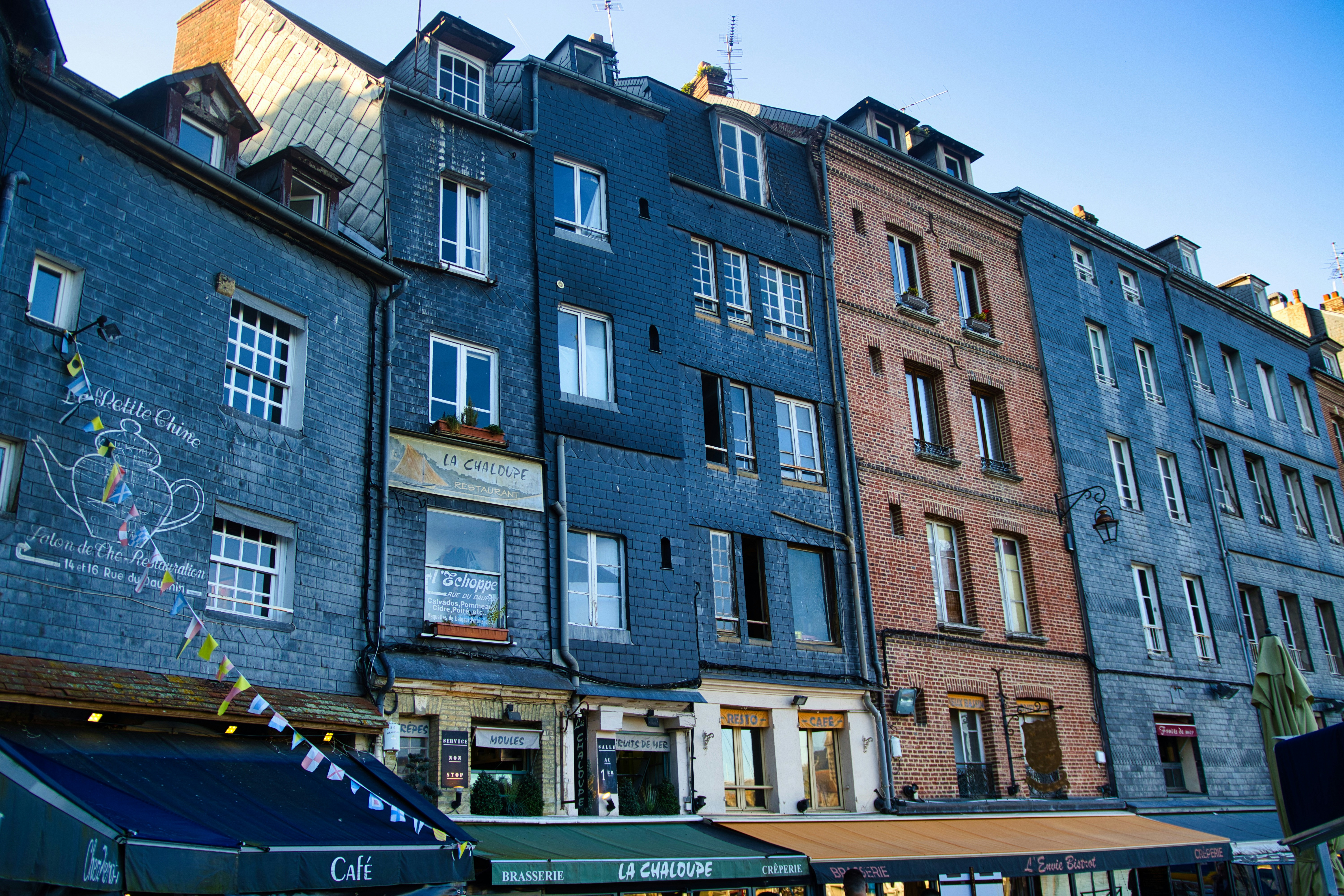 Row of colorful old buildings along a street.