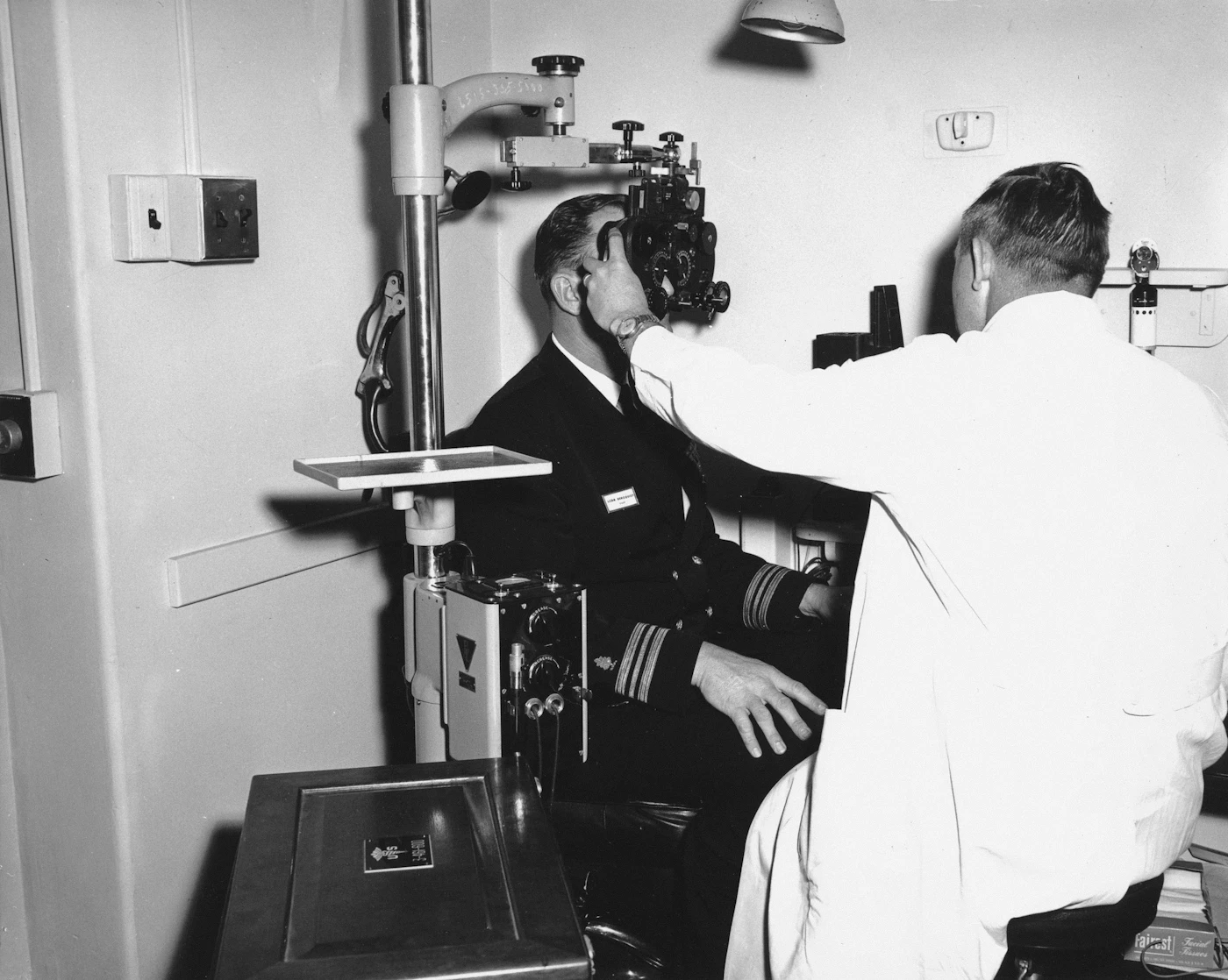 Vintage ophthalmic refraction equipment in a clinical room.