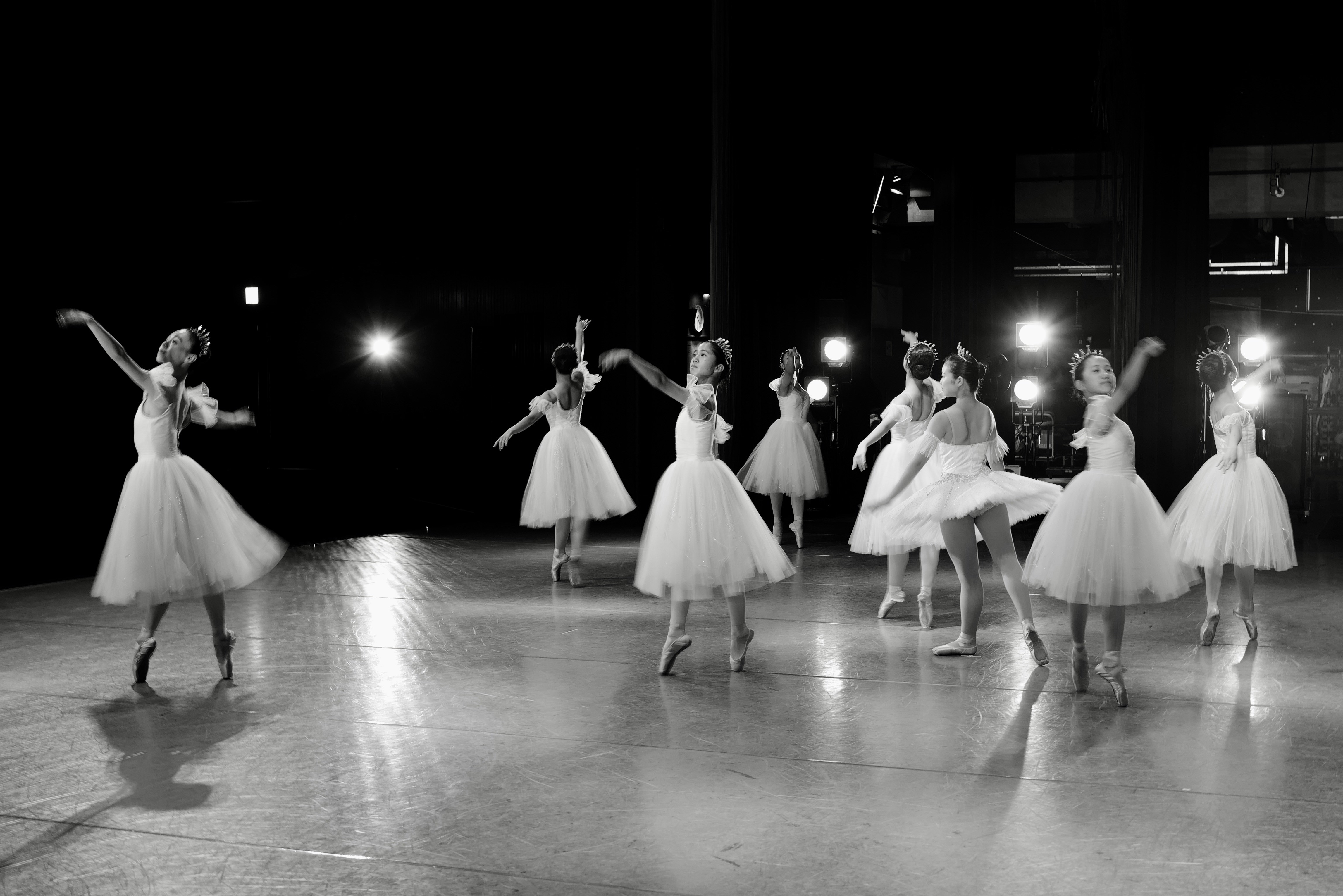 Ballet dancers in white tutus performing