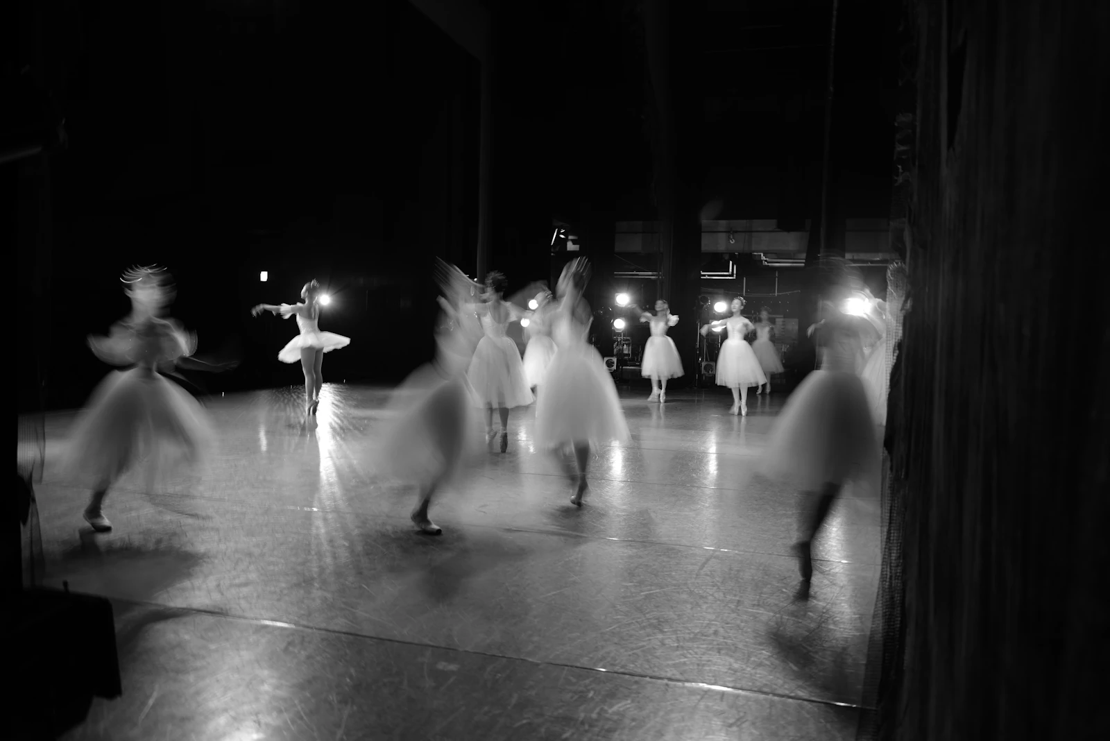 Ensemble performing on a dimly lit stage