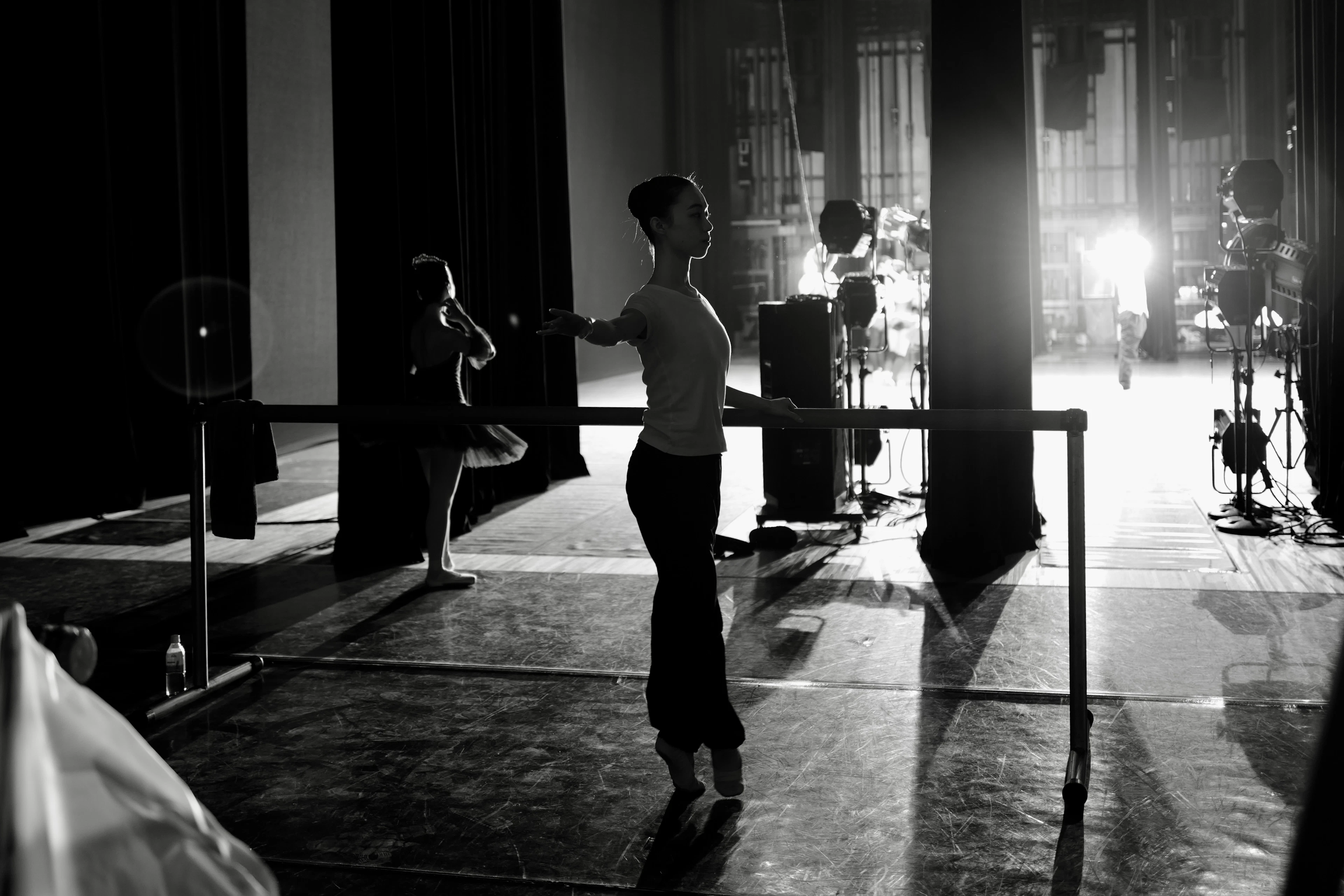 Dancers at a barre with mirrors