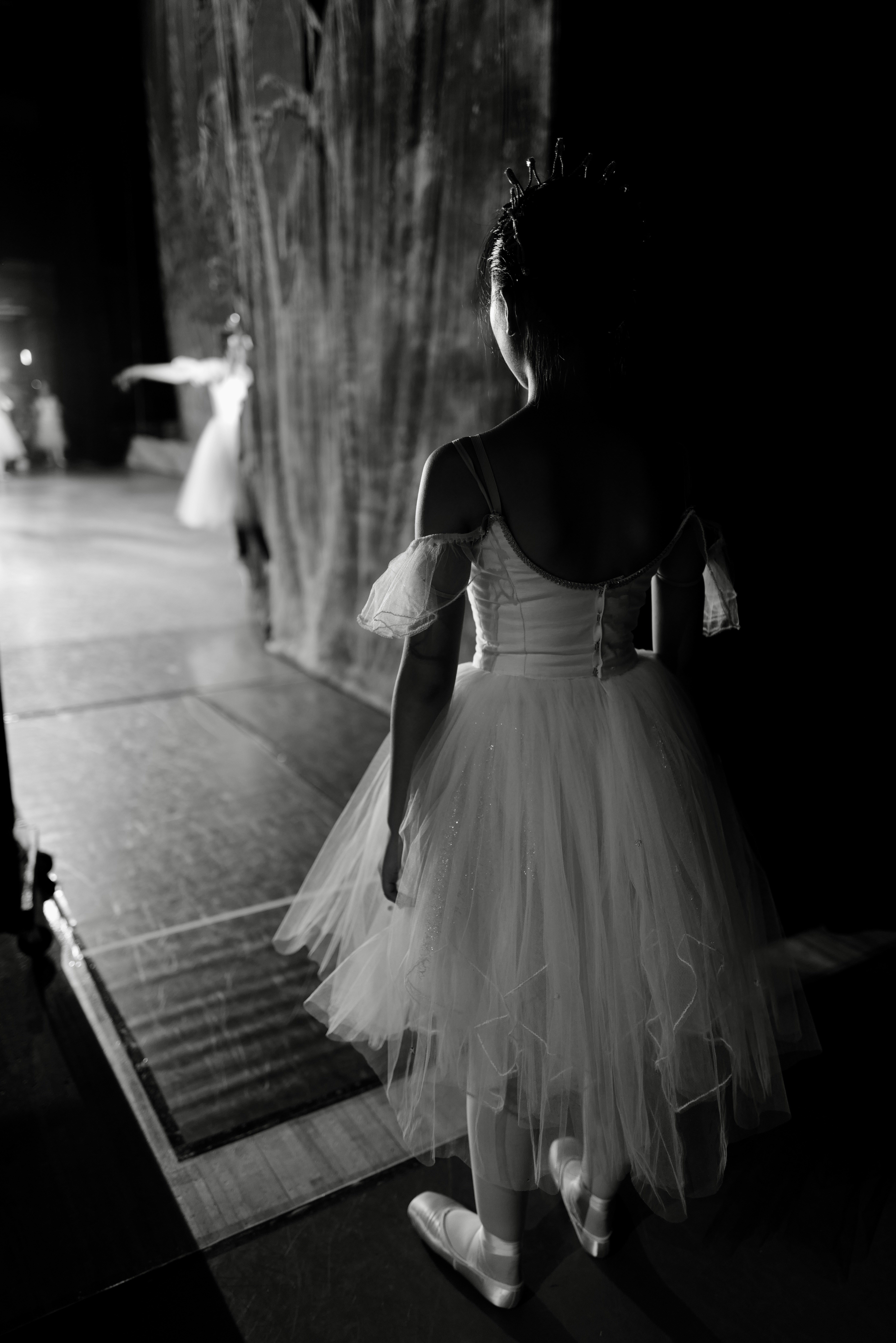 Young ballerina in tutu backstage before performance