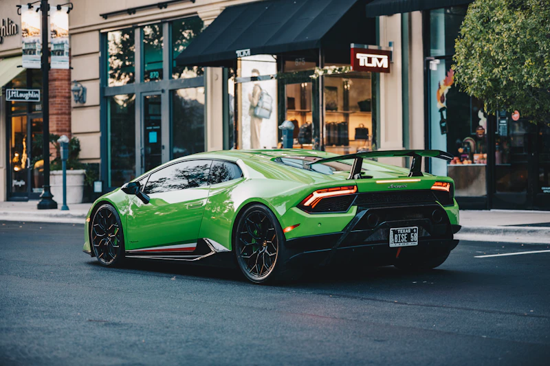 A vibrant green sports car parked on a street, bold luxury