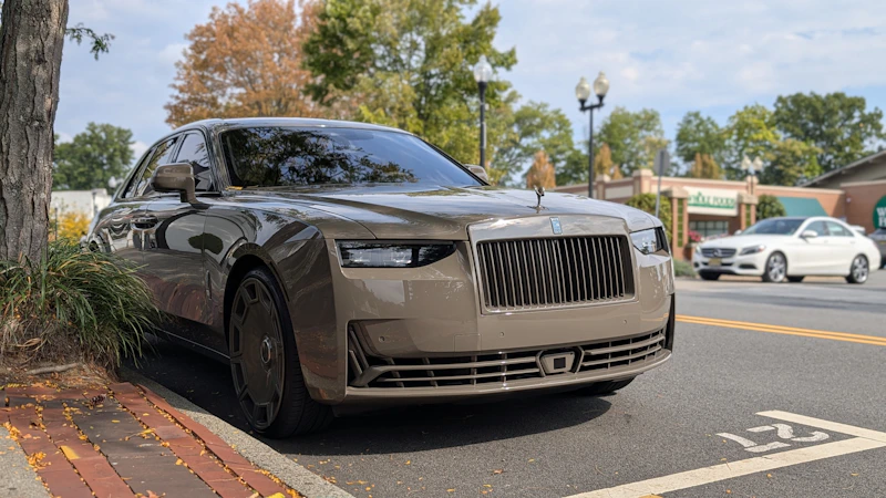 A luxury sedan parked on a street, sophisticated transport